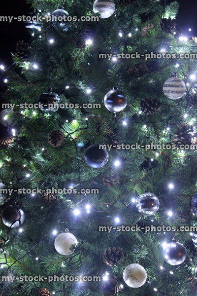 Stock image of Christmas tree at night, white led, fairy lights
