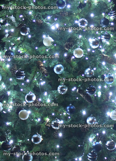 Stock image of Christmas tree at night, white led, fairy lights