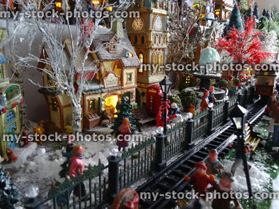 Stock image of model Christmas village with miniature railway, people, winter scene