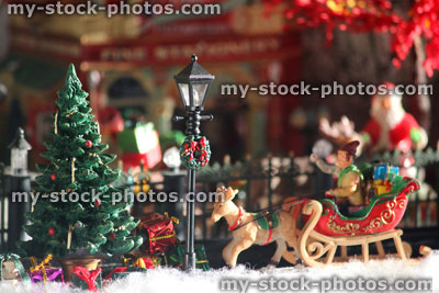 Stock image of model Christmas village with sleigh, Santa, people, winter scene