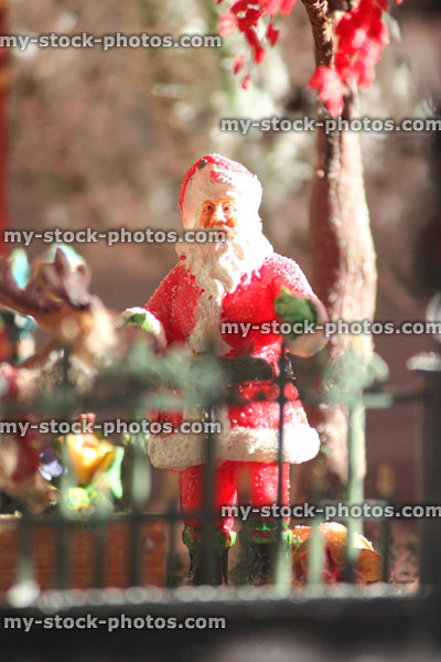 Stock image of model Christmas village with Santa figurine, people, winter scene