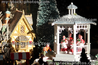 Stock image of model Christmas village, children's choir / gazebo / band stand, people, winter scene