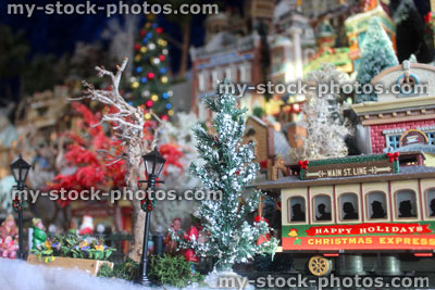 Stock image of model Christmas village, Santa claus, tram / trolley bus, people, winter scene