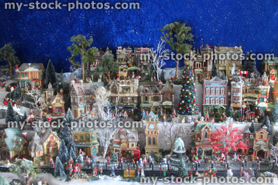 Stock image of model Christmas village with miniature houses, people, winter scene