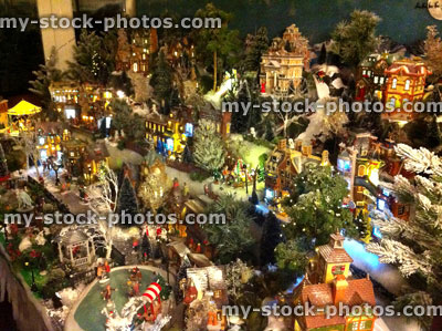 Stock image of model Christmas village, miniature houses, people, night scene
