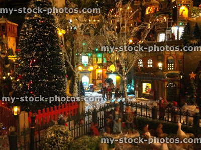 Stock image of model Christmas village, miniature houses, people, night scene