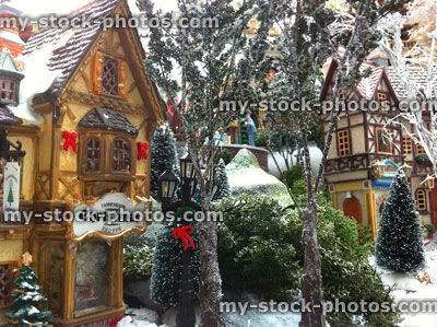 Stock image of model Christmas village with miniature houses, people, winter scene