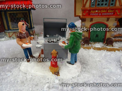 Stock image of model Christmas village , miniature houses, people, winter bbq