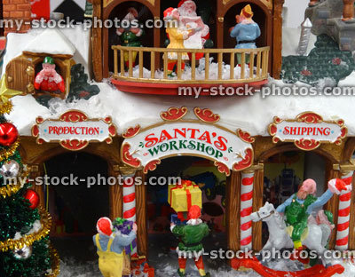 Stock image of model Christmas village with miniature houses, people, winter scene, Santa's workshop
