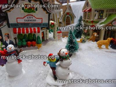Stock image of model Christmas village , miniature houses, people, snowmen