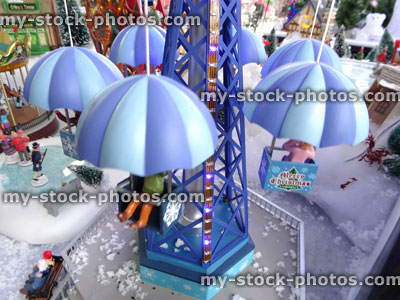 Stock image of model Christmas village with Carnival rides, iceskating rink