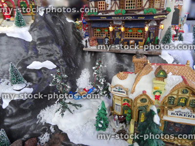 Stock image of model Christmas mountain village with miniature houses, people