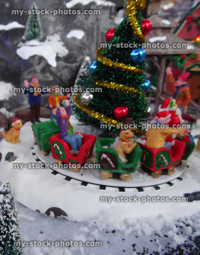 Stock image of model Christmas village with Christmas tree, train ride 