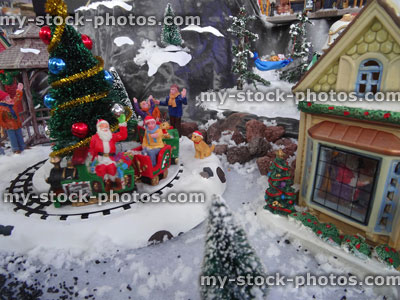 Stock image of model Christmas village with miniature houses, people, Christmas tree