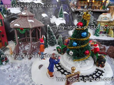 Stock image of model Christmas village with miniature houses, people, Christmas tree