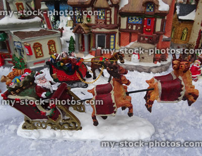 Stock image of model Christmas village, Father Christmas / Santa, flying reindeer