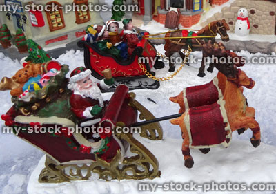 Stock image of model Christmas village, Father Christmas / Santa, reindeer sleigh