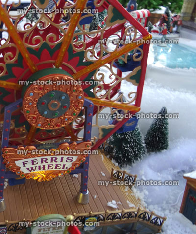 Stock image of model Christmas village with Ferris Wheel and iceskating rink