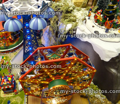 Stock image of model Christmas village with miniature houses, people, Ferris Wheel