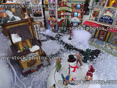 Stock image of model Christmas village with miniature houses, people, snowman