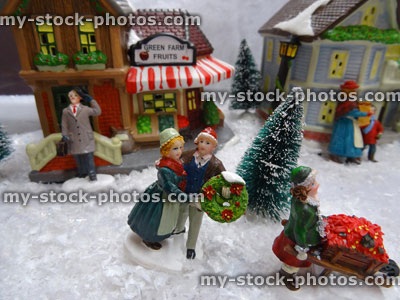 Stock image of model Christmas village , miniature houses, people, children