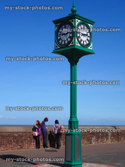 Stock image of iron clock tower painted green on Minehead beachfront