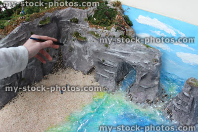 Stock image of painting cliffs for school homework project, coastal erosion model