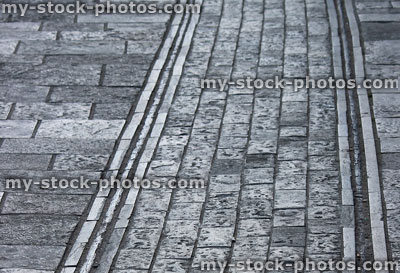 Stock image of cobblestone street with historic tram lines / rails / path