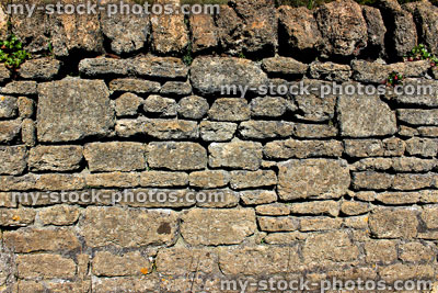 Stock image of dry stone wall on a sunny day (close up)