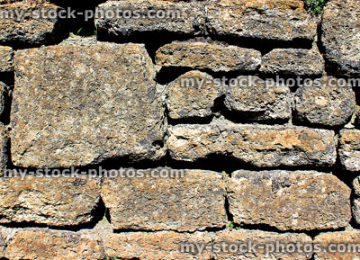 Stock image of old dry stone wall with irregular blocks, lichens