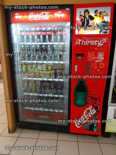 Stock image of Coca Cola vending machine with fizzy drinks / bottles