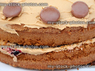 Stock image of homemade coffee cake decorated with cream / chocolate buttons