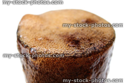 Stock image of fizzy cola being poured into glass, bubbles, overflowing