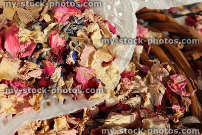 Stock image of natural biodegradable wedding confetti cones, dried delphinium / rose flower petals
