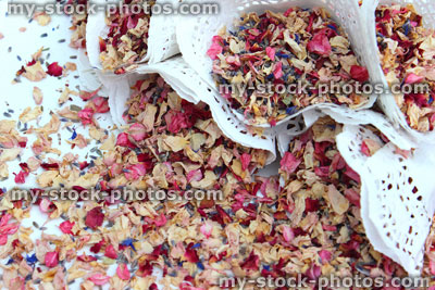 Stock image of natural biodegradable wedding confetti cones, dried delphinium / rose flower petals