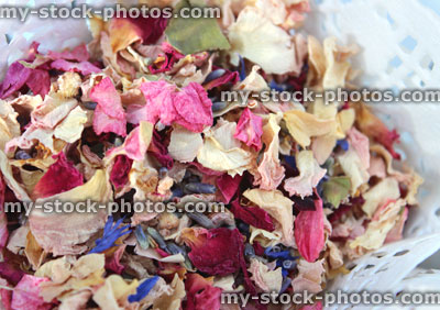 Stock image of natural biodegradable wedding confetti cone, dried delphinium / rose flower petals