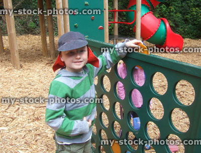 Stock image of boy playing giant Connect 4 game