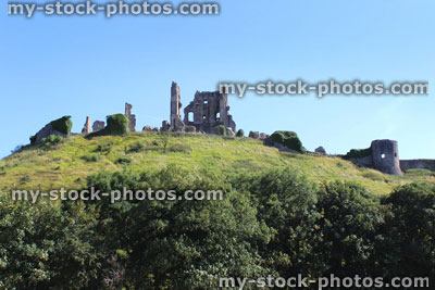 Stock image of historic 11th century Corfe Castle ruins / fortifications on hill top, Dorset, England