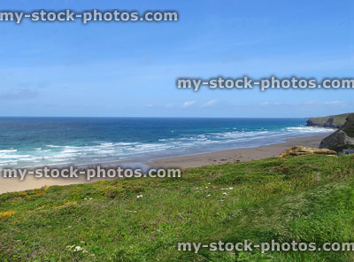 Stock image of wild surfing beach near Newquay, Cornwall, blue sea-sky