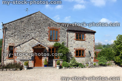 Stock image of traditional stone cottage villa in English countryside setting