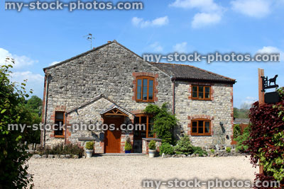Stock image of traditional stone cottage villa in English countryside setting