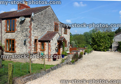 Stock image of cottage house in English countryside, with chickens / smallholding