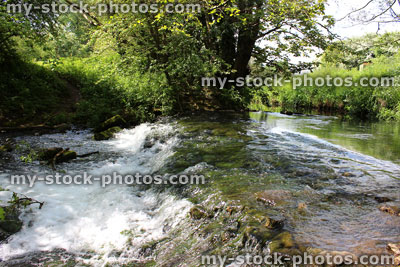 Stock image of stream / waterfallHealthy fast flowing river with clear water travelling over a weir