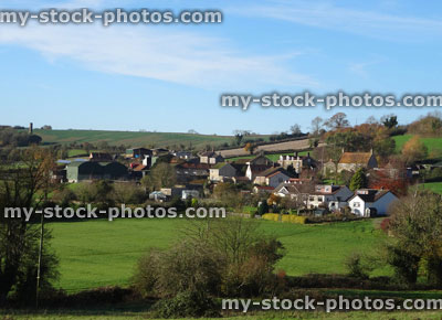 Stock image of small farming village with houses, cottages, fields, countryside