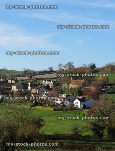 Stock image of small farming village with houses, cottages, fields, countryside