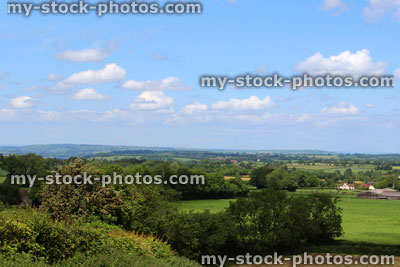 Stock image of English countryside scenery, view from hilltop, farmland fields