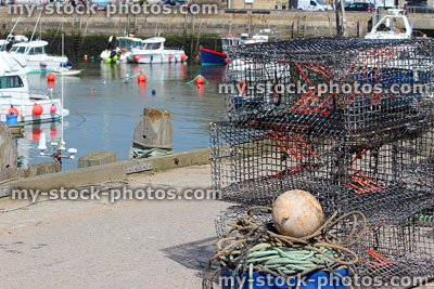 Stock image of fishing harbour with lobster pots and pleasure boats