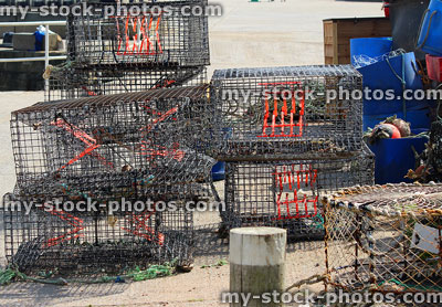 Stock image of crab and lobster pots at seaside fishing harbour