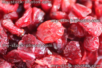 Stock image showing pile of dried cranberries / red cranberry fruit healthy snacks