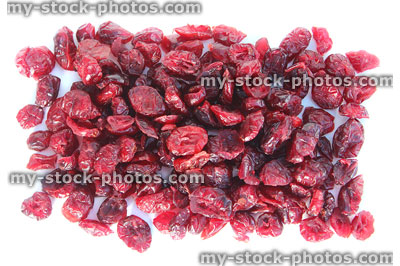 Stock image showing pile of dried cranberries / red cranberry fruit healthy snacks